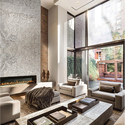 living room featuring natural stone fireplace