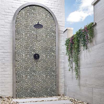 Rio Lago Pebble Mosaic Backsplash Tile in outdoor shower